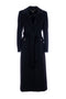 Long black regular coat with peak lapels and sash
