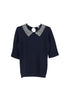 Polo aderente blu scuro in maglia con strass